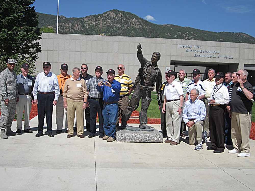 The guys gathered around Karl's statue.